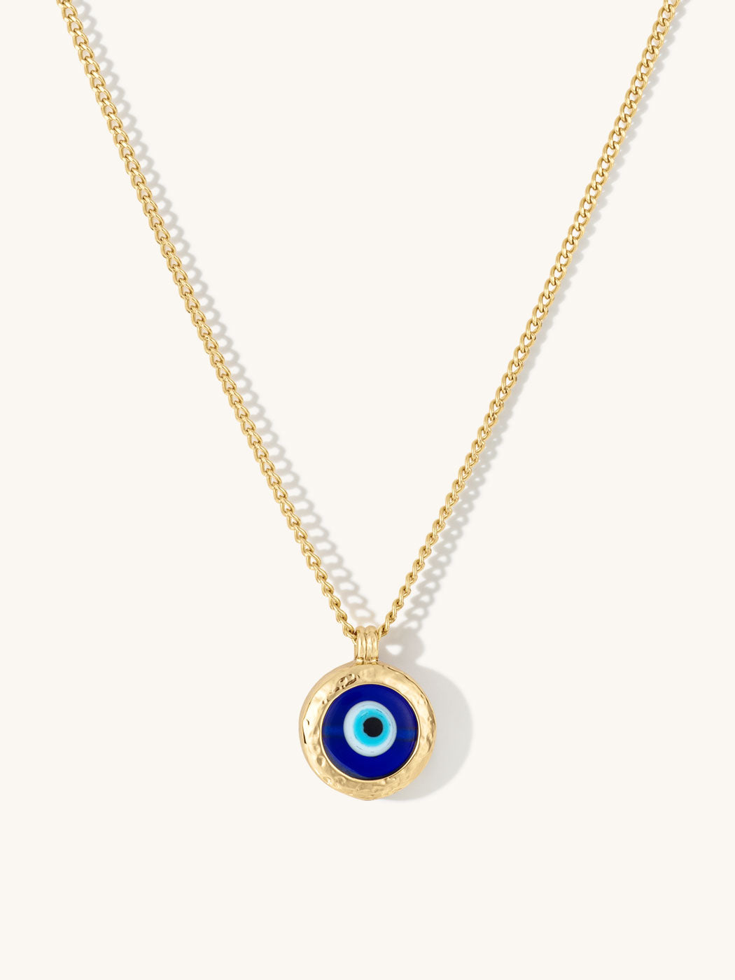 Necklace with a blue evil eye pendant on a white background