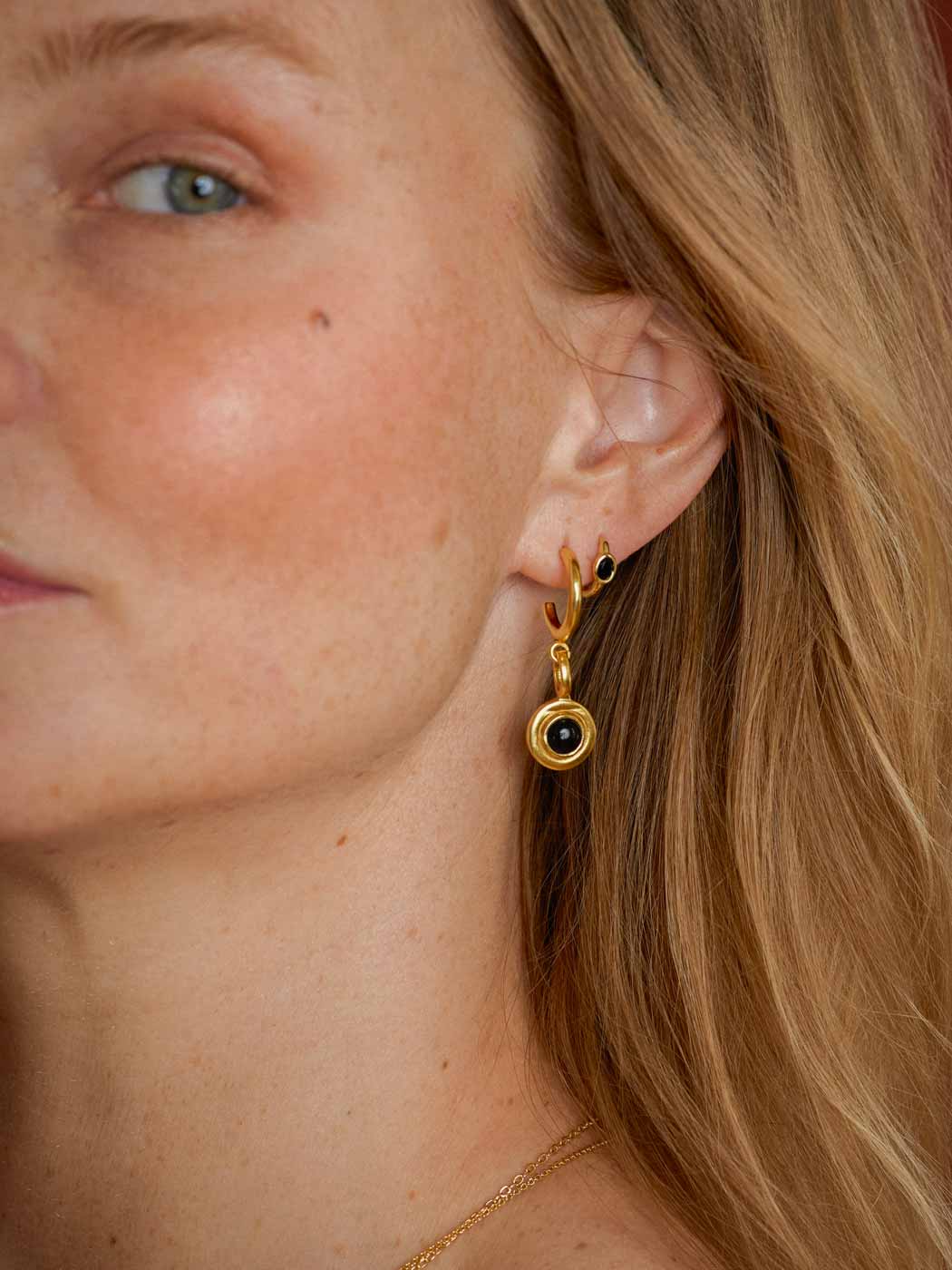 black agate gemstone huggie paired with larger hoop