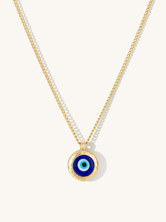 Necklace with a blue evil eye pendant on a white background