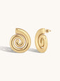 Gold spiral earrings on a white background