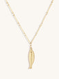 Gold fish pendant necklace on a white background