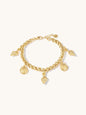 Gold chain bracelet with shell charms on a white background